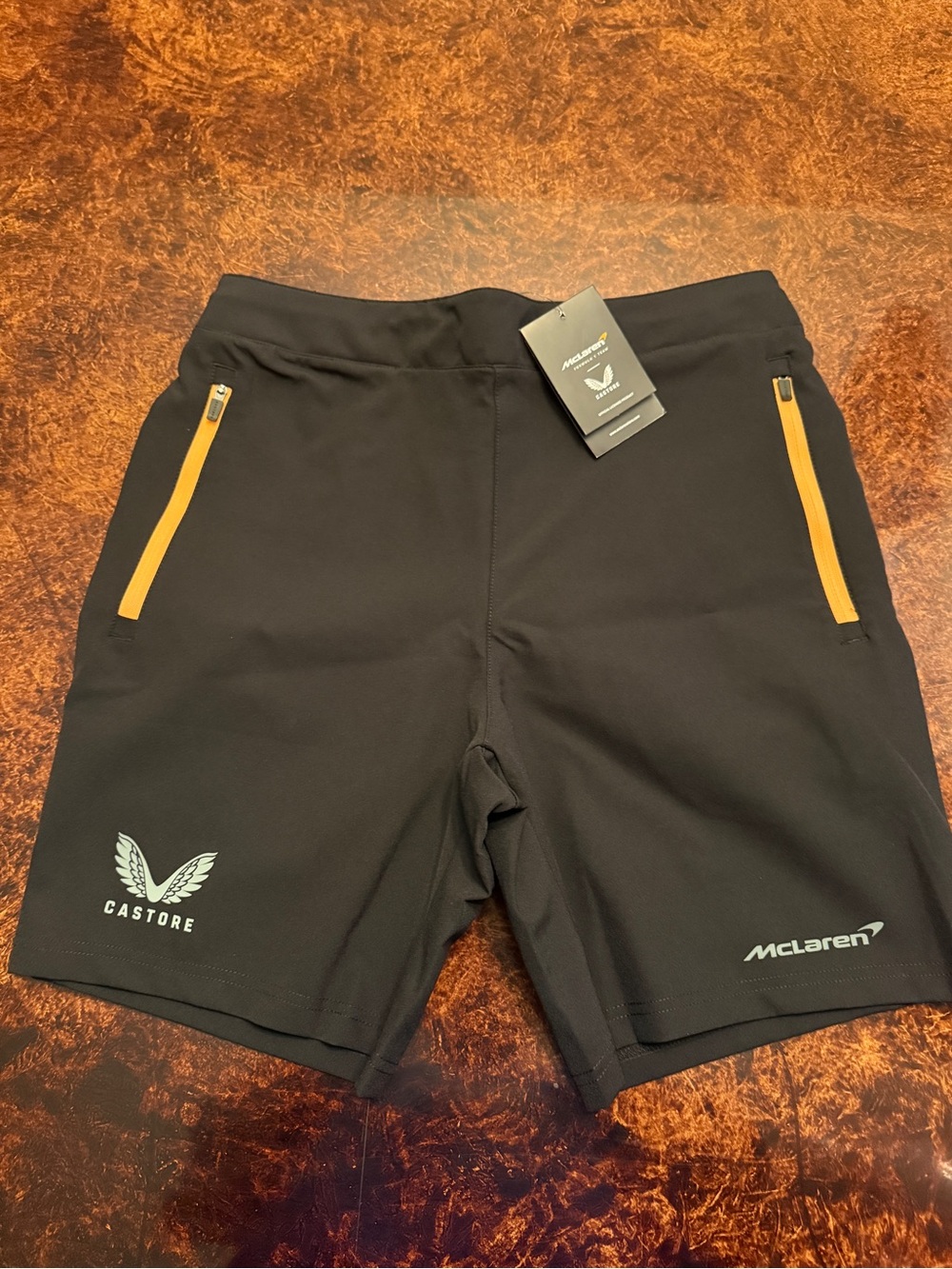 McLaren Men’s Black Athletic Shorts with Orange Zip Accents